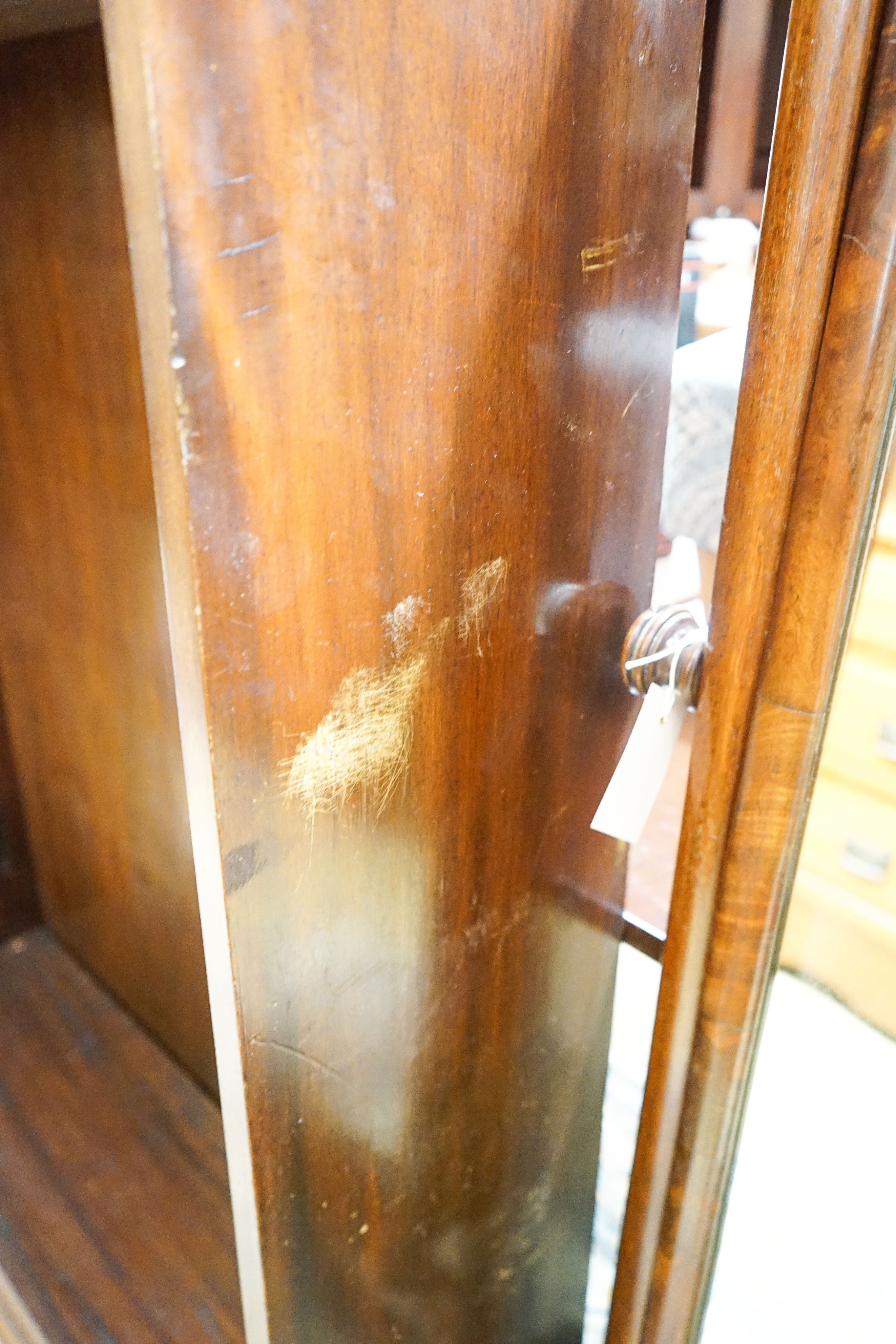 A 1920's mahogany open bookcase, length 92cm, depth 25cm, height 130cm